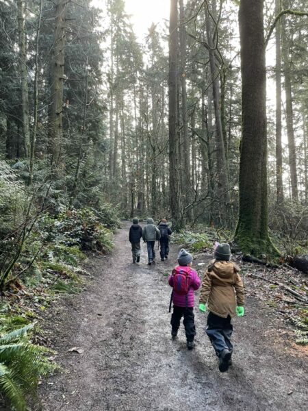 Kids walk down park trail 